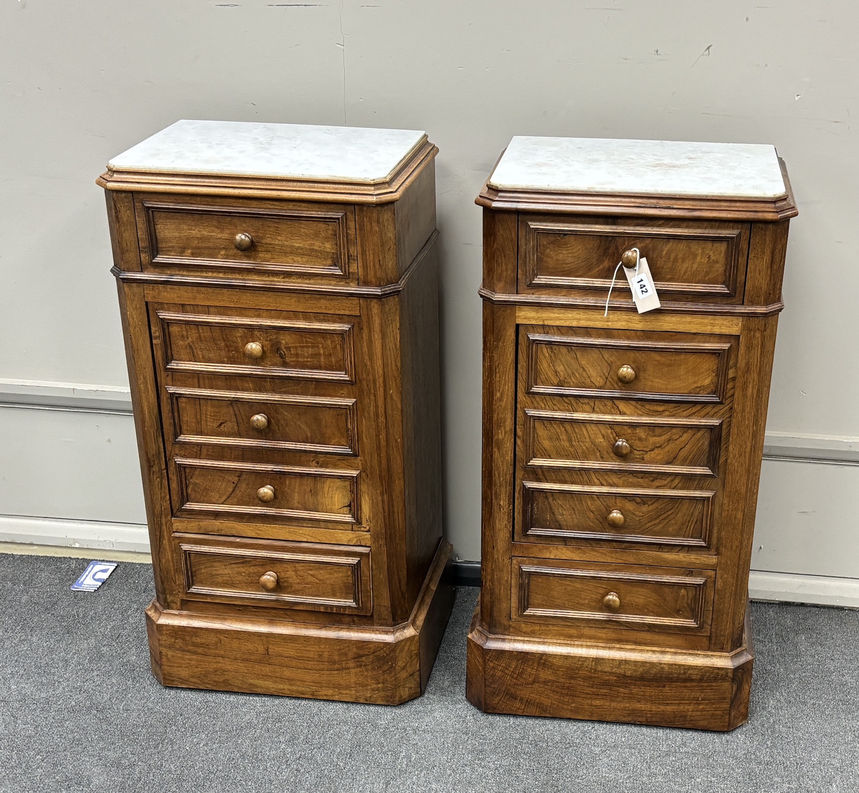 A pair of late 19th century French walnut marble topped bedside cabinets, width 44cm, depth 32cm, height 87cm